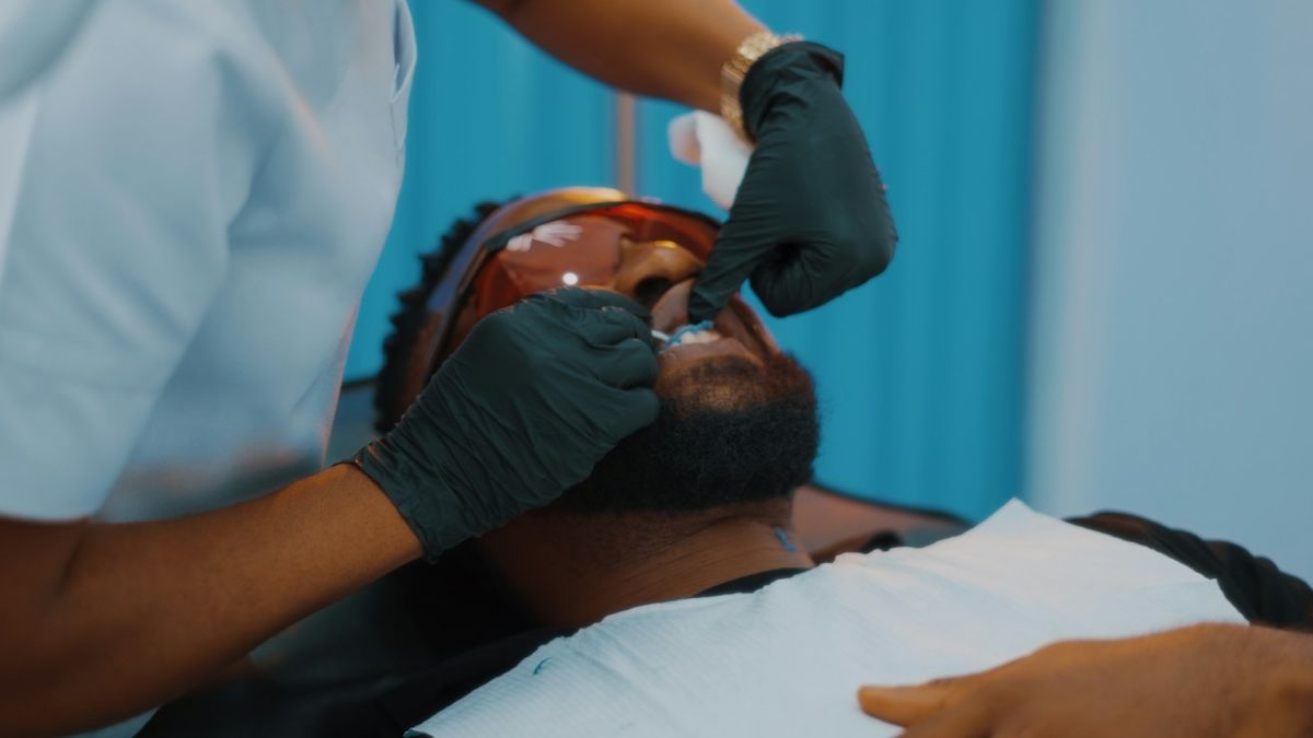 Dentist examining a patient (illustrative stock photo)